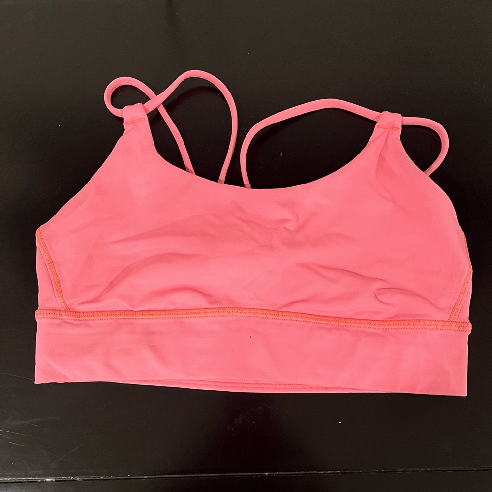 Lululemon sports bra, Color is coral, fits size 34b.
